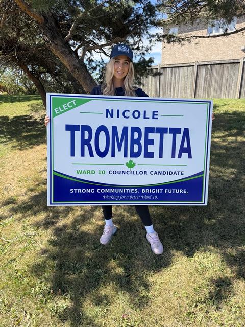 Nicole with her Elect Nicole Trombetta lawn sign