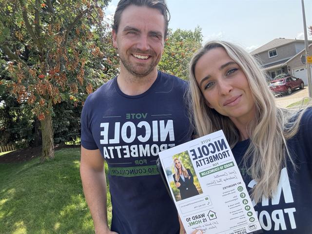 Nicole canvassing with a volunteer