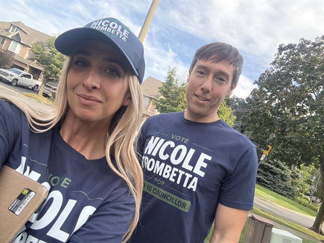 Nicole canvassing with a volunteer
