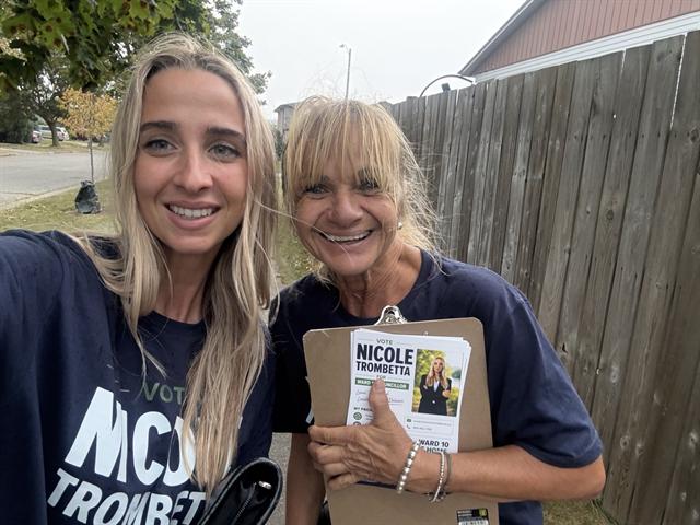 Nicole canvassing with a volunteer