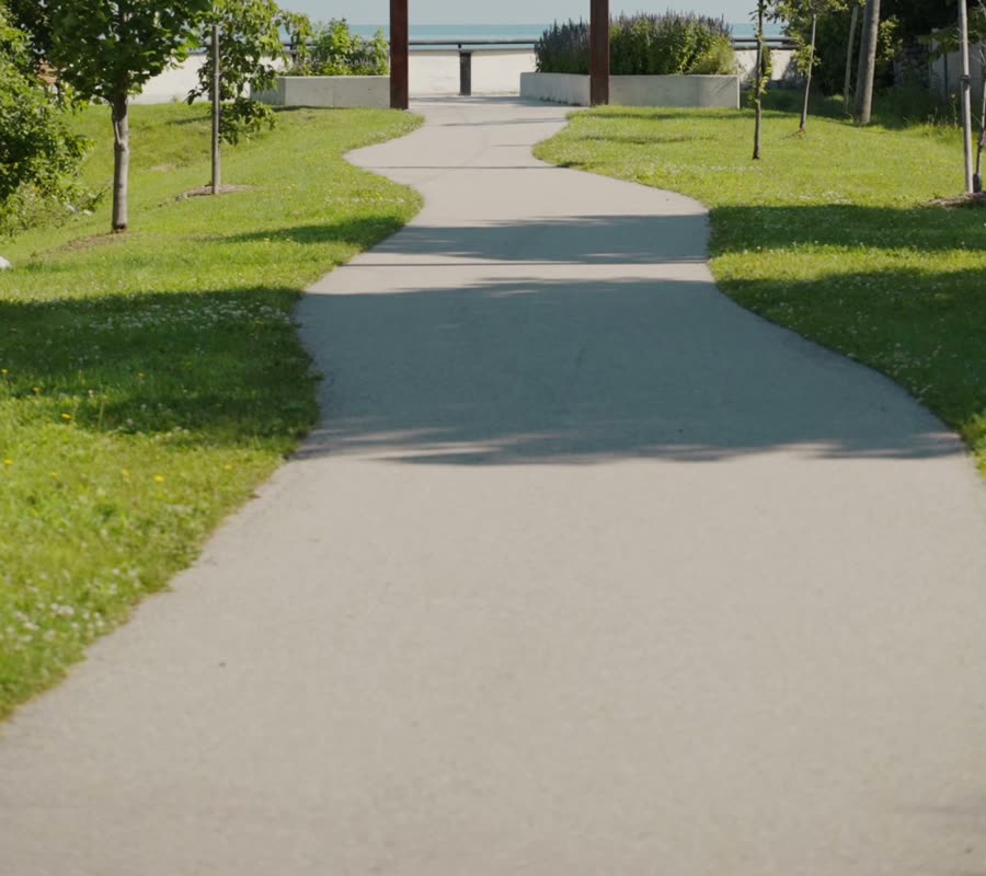 A park path leading to the Lake Ontario waterfront